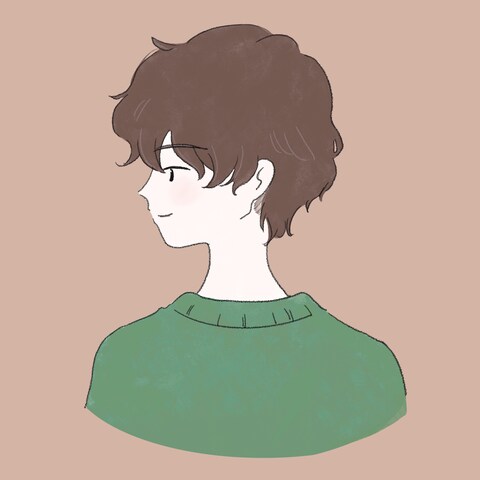 パーマをかけた、優しい雰囲気の男性のアイコン