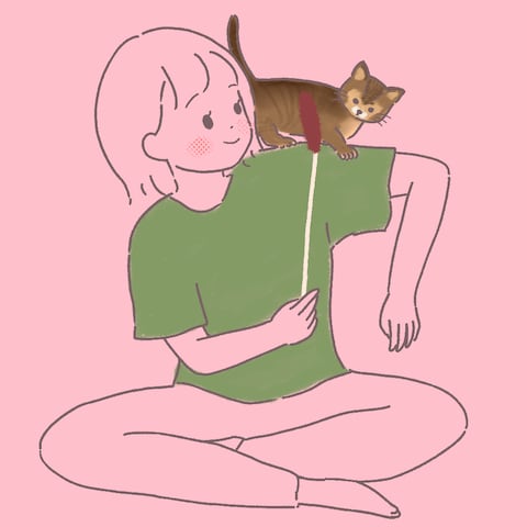 猫と戯れる女の子