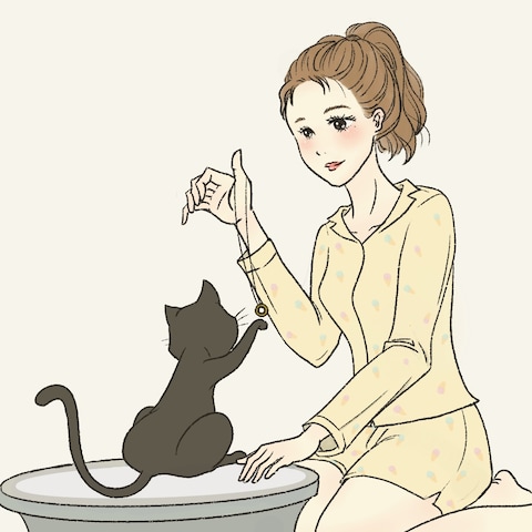 猫と遊ぶ女性