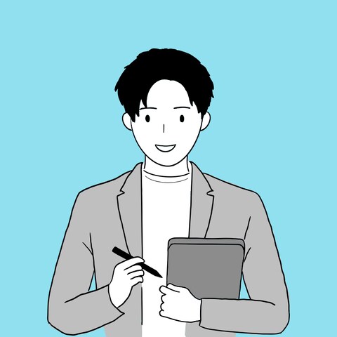 ペンとiPadを持つ男性