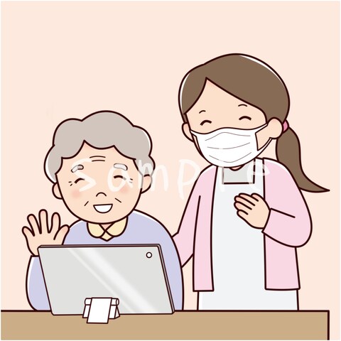 オンライン面会をする笑顔の高齢者女性と医療スタッフ