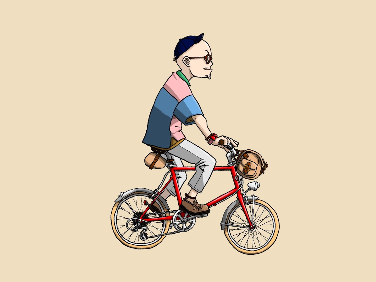 自転車に乗ったスキンヘッドオジサン